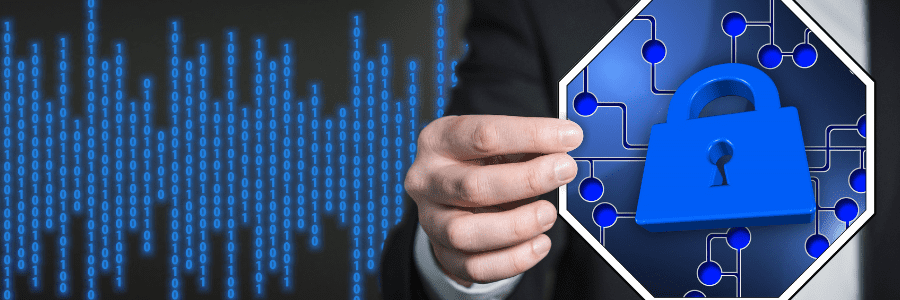 Hand holding lock image in front of computer code screen