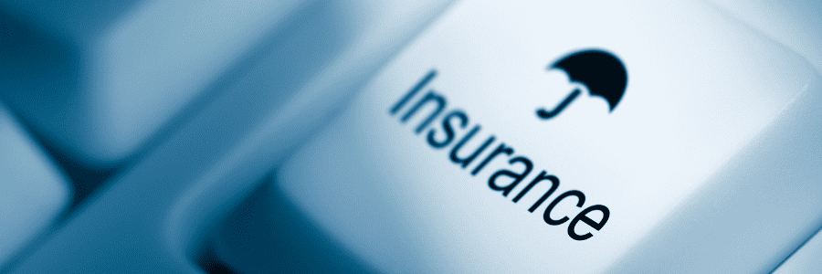 Close up of a computer keyboard key with the word insurance with an umbrella