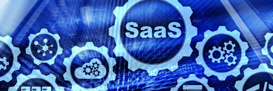 The word SaaS and software icons in gears on computer screen background